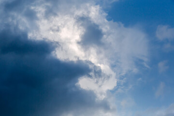Part of sky with storm cloud edge against blue sky