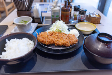 Japanese Breakfast. Fried Chicken with Salad, Rice and Sause. Miso Soup