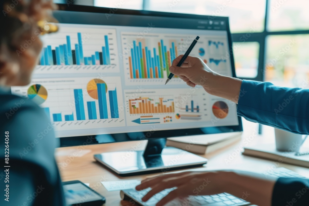 Poster business team discussing financial data and charts, with hands holding a pen pointing at a presentat