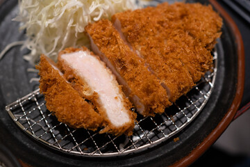 Close-up view of Japanese deep-fried pork, or tonkatsu cut in sliced.