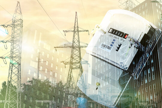 Electricity meter, building and high voltage towers, multiple exposure