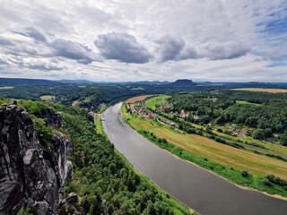 Fototapeta premium The Bastei is a rock formation rising 194 metres (636 ft) above the Elbe River in the Elbe Sandstone Mountains of Germany.