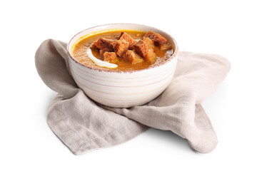 Bowl of tasty cream soup with croutons on white background