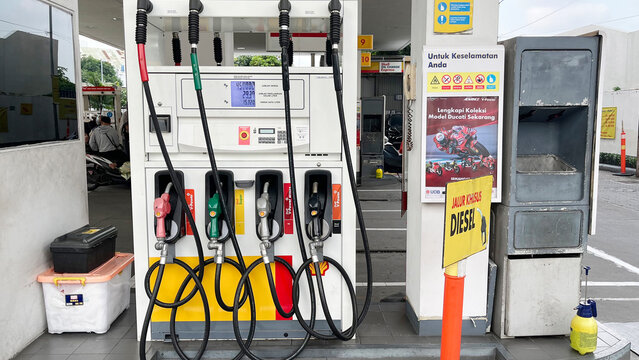 Jakarta, Indonesia - July 09 2024: Shell petrol station in Jakarta province. Fuel dispenser. The fuel nozzles are arranged in several colors. Gasoline and diesel service stations
