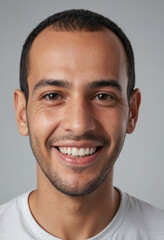 Obraz premium Portrait view of a regular happy smiling Tunisia man, ultra realistic, candid, social media, avatar image, plain solid background