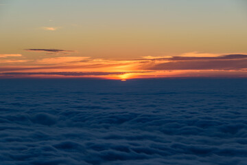 Dawn over the clouds