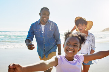 Family, parents and girl running on beach for holiday, vacation and wellness, health or freedom to travel. African child and dad, mom or happy people for outdoor adventure, games and playing by ocean © ReeseArcurs/peopleimages.com