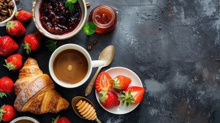 Top view of coffee jam croissant and strawberry breakfast