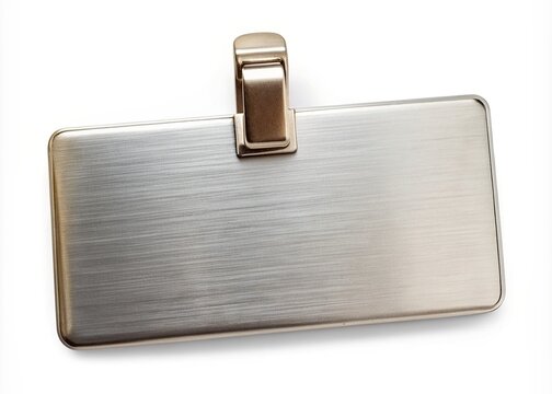 Shiny blank metal name tag with a silver finish and a sturdy clip attached, isolated on a white background, waiting for customization.