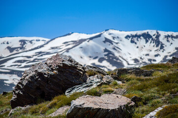 Panoramic view on snowy mountains on hiking trail to Mulhacen peak in the spring, Sierra Nevada range, Andalusia, Spain