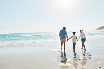 Black family, back and holding hands with child on beach for bonding, holiday or outdoor weekend....