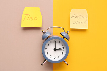 Papers with texts TIME, IF NOT NOW WHEN? and alarm clock on colorful background. Time management....