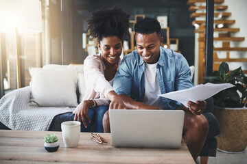 Couple, laptop and happy with documents for bills on sofa with planning taxes or loan application...