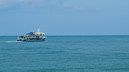 Fishing Ship In The Calm Sea. Fishing Boat Out In The Ocean Or Sea Wide. Still. © artifex.orlova