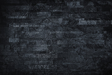Obraz premium Black wall made of natural stone. Cold dark background