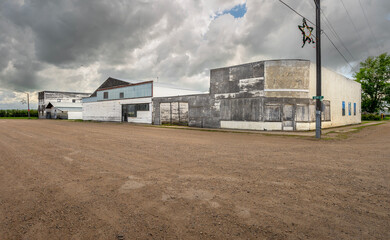 Abandoned buildings at an intersection in the village of Hodgeville, Saskatchewan, Canada