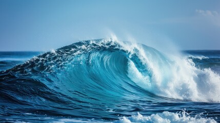 Stunning ocean wave crashing into blue sea under clear sky, capturing the power and beauty of nature.