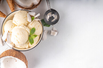 Vegan creamy coconut sorbet ice cream. Bowl with classic white coconut flavor non-dairy vegetarian gelato made with coconut milk, creamy frozen summer dessert