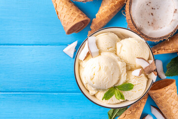 Vegan creamy coconut sorbet ice cream. Bowl with classic white coconut flavor non-dairy vegetarian gelato made with coconut milk, creamy frozen summer dessert