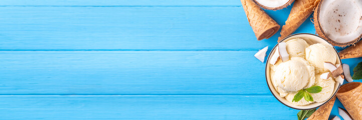 Vegan creamy coconut sorbet ice cream. Bowl with classic white coconut flavor non-dairy vegetarian gelato made with coconut milk, creamy frozen summer dessert