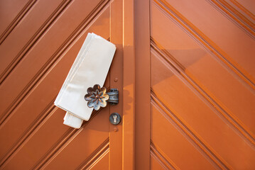 Fresh Newspaper in Wooden Door Handle, Mail Delivery