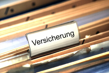 Paper file with insurance tag