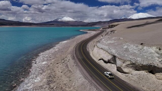 Stunning aerial footage of Laguna Verde South America's natural splendor lagoons vibrant colors. Aerial shot of Laguna Verde presenting majestic landscape of South America tranquil environment.