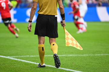 Assistant of football referee during the match