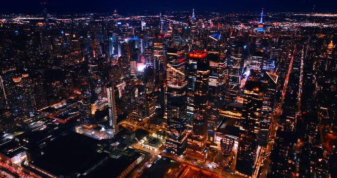 Dazzling night in majestic New York, the USA. Top view on the city scenery with fantastic illumination.