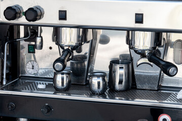 Expresso machine making coffee in a street cafe in the morning.