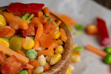 a mixture of quick-frozen corn, peas, peppers, and carrots