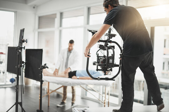 Man, videographer and recording with camera for practice, online vlog or filmaking at studio. Photographer, producer or director with physical therapist for behind the scenes, tutorial or production