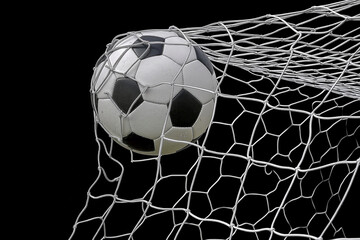 Soccer Ball Hitting Net with Black Background, Perfect for Sports and Athletic Advertising Themes