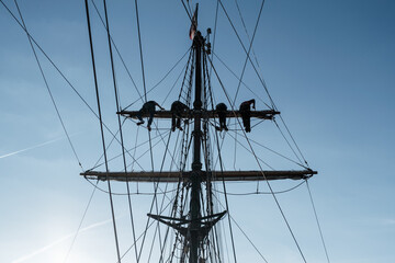 Sailors Climbing Rigging on Tall Ship