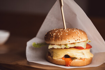 Burger in paper. Cafe