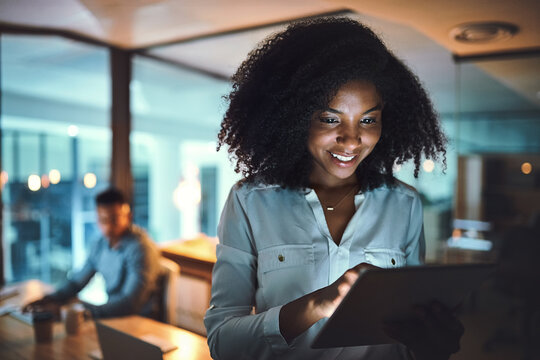 Tablet, research and woman in office at night with stock market analysis for risk management. Digital technology, data and African female financial broker with foreign exchange trading for client. - Powered by Adobe