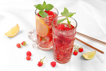 Refreshing summer homemade lemonade cocktail, mojito with raspberries, currants, mint and lemon, fruit flavored detox water, weight loss concept, healthy and natural food, .