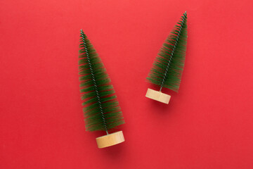 Small christmas tree on color background, top view