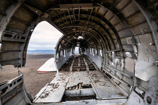 Inside view of the iconic abandoned DC-3 plane wreck on Solheimasandur beach in Iceland, a popular spot for photographers and adventurers