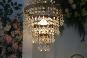 Luxury crystal chandelier in the interior of the room