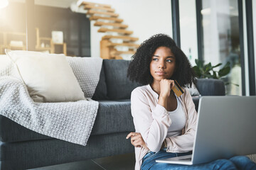 Thinking, laptop and woman with credit card in living room for subscription, payment or online...
