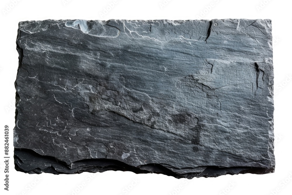 Poster a piece of slate sitting on a flat surface, ready for use