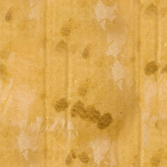 Seamless 4k photo texture of wet and stained used cardboard paper.
