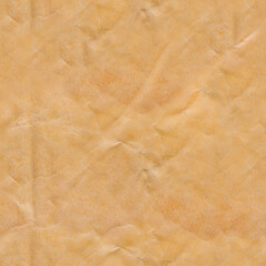 Seamless 4k photo texture of brown colored crumpled and used parcel cardboard paper.