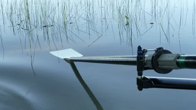 hatchet sculling oar on a calm lake, Boyd Lake in Colorado