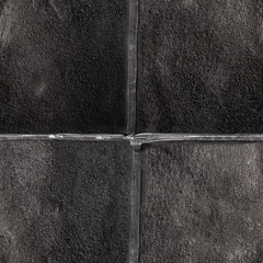 Seamless 4k photo texture photo of black colored suede leather material sewn together.