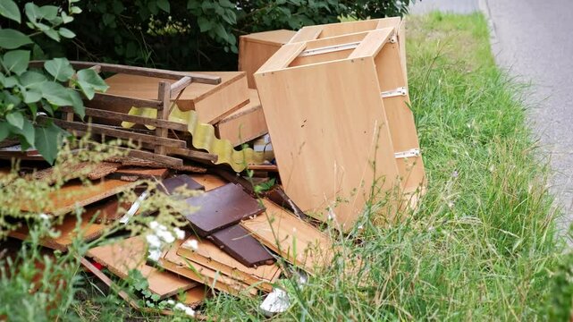 Old Furniture Disposed by New House Owner During Renovation Prepared for Curbside Garbage Pickup by City Cleaning Services