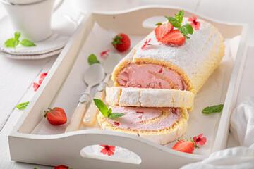 Tasty and fresh strawberry roulade with berry fruits.