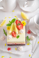 Homemade and fresh strawberry sponge cake with berries and citrus.