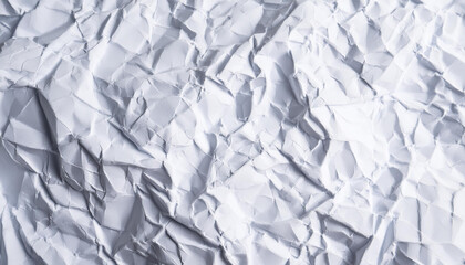 Obraz premium Crumpled white paper background. Top view.
